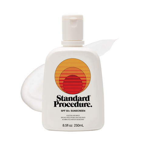 Sunscreen lotion SPF 50 pump bottle with a subtle lotion smear on a clean white background.