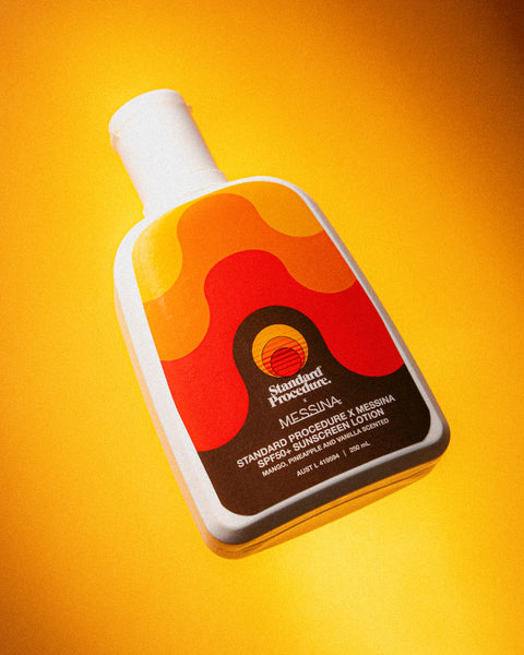 body sunscreen spf 50 bottle angled against a bright yellow background