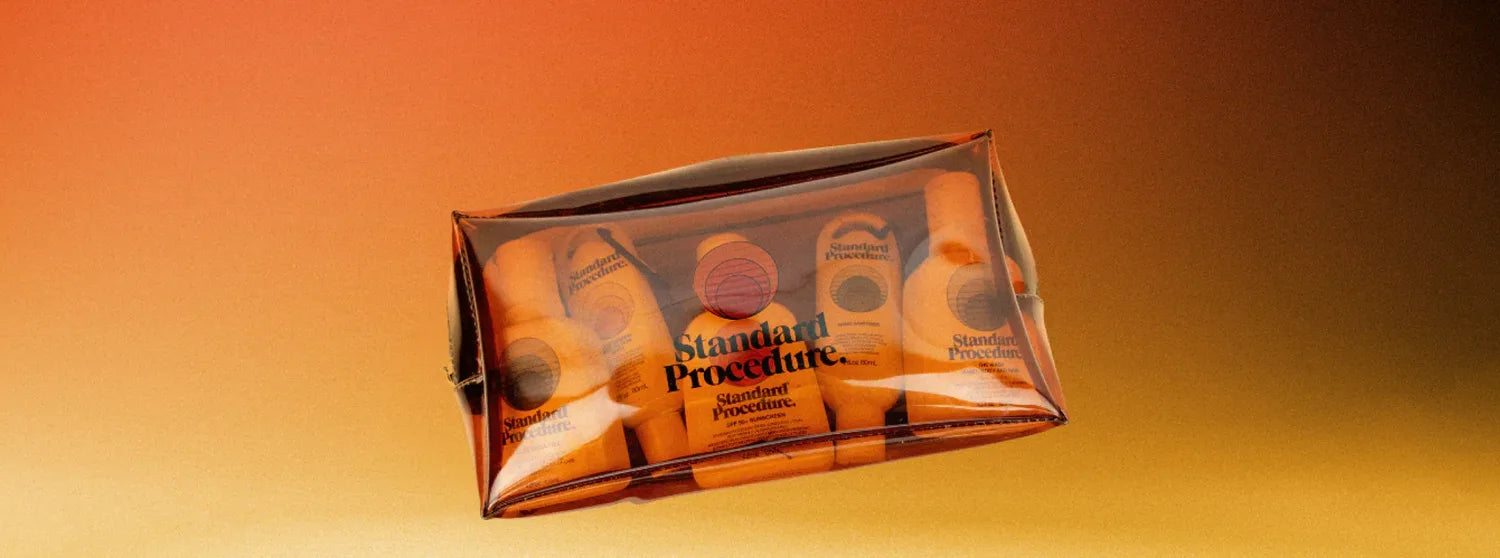 Standard Procedure gift pack of travel-size SPF 50 sunscreen and skin care in a clear pouch.