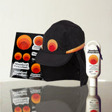 Standard Procedure Grom Pack with a black sunset logo cap, sticker sheet, and SPF 50 Sunscreen 60ml travel tube.