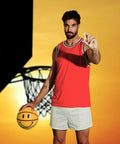 Man in a red basketball jersey holding Standard Procedure SPF 50 Lip Balm with a smiley-face basketball on court.