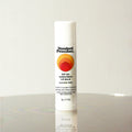 Standard Procedure SPF 50 Sunscreen Lip Balm in coconut flavour on a reflective surface with a neutral background.