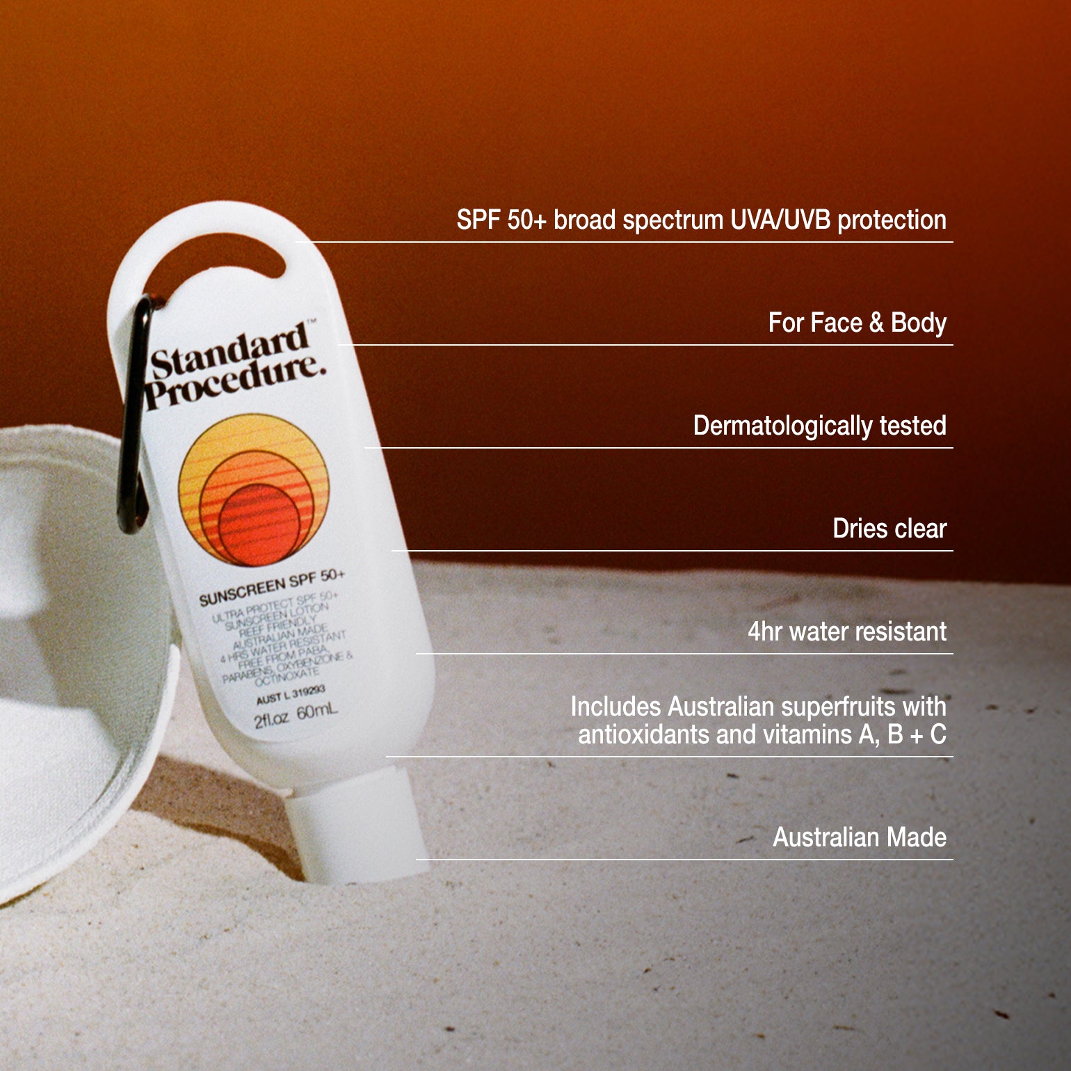 Broad spectrum SPF 50 sunscreen bottle from Standard Procedure placed on sand with an orange backdrop, highlighting its water resistance, antioxidants, and UVA/UVB protection