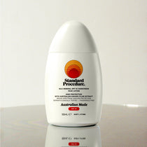 Standard Procedure Silk Mineral SPF 50 Sunscreen face lotion 50ml with Kakadu Plum extract on a reflective surface.