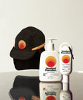 Standard Procedure Sport Hat Pack with a black sunset logo cap, SPF 50 Sunscreen 500ml, and a 60ml travel tube.