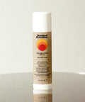 Standard Procedure Tan Zinc Stick SPF 50 tinted mineral sunscreen stick 17g on a reflective surface.