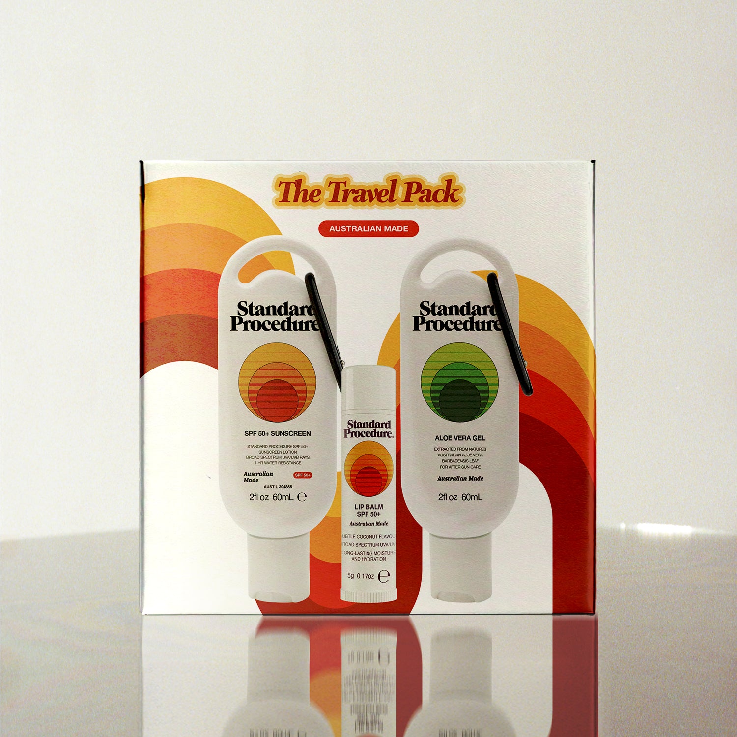 Standard Procedure Travel Pack containing SPF 50 Sunscreen, Aloe Vera Gel, and Lip Balm in a retro-styled gift box.