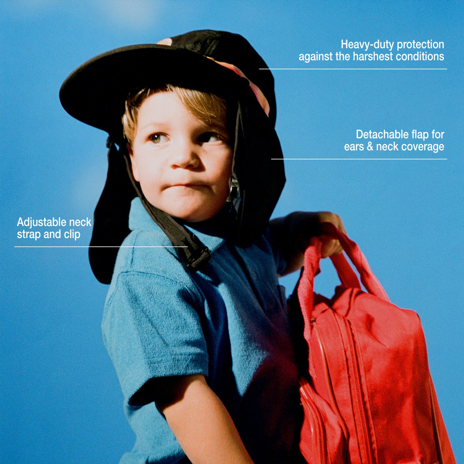 Small surf hat worn by a young child holding a red backpack, featuring adjustable neck strap, detachable flap for sun protection, and lightweight coverage for outdoor play