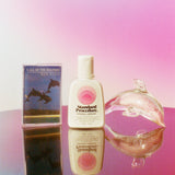 Standard Procedure Pleasure Jelly lubricant bottle beside a glass dolphin and Ken Davis cassette tape.