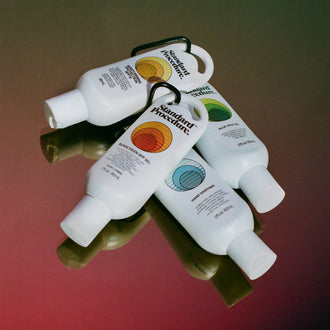 Clip-on 60ml travel kit with aloe vera gel, sunscreen, SPF moisturiser, and hand sanitiser bottles.